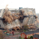Illustration for article titled The Joy Of Watching Huge Buildings Implode